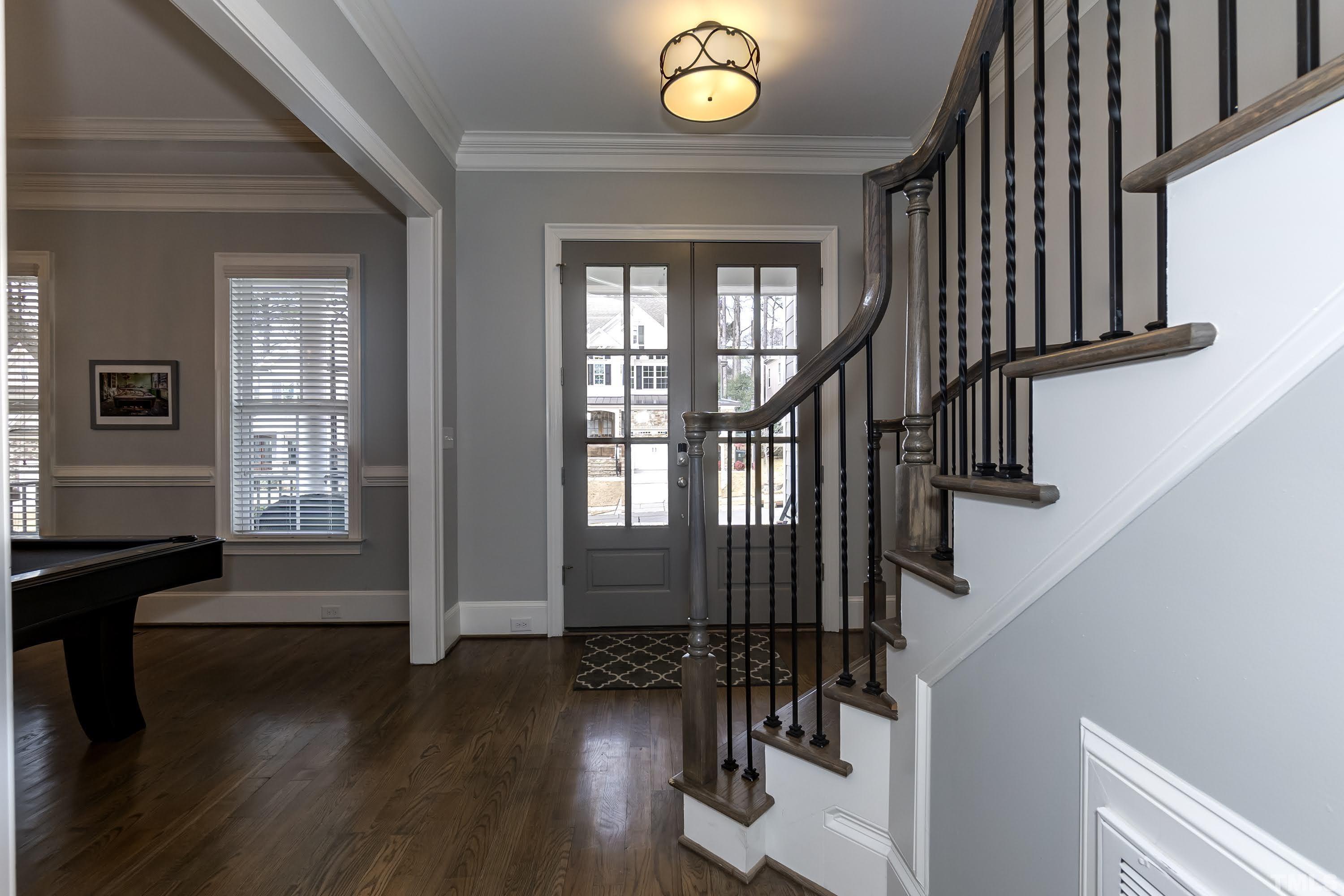 6418 Rosny Road Raleigh, NC 27613 - Photo 5 of 52 a view of entryway with wooden floor and stairs