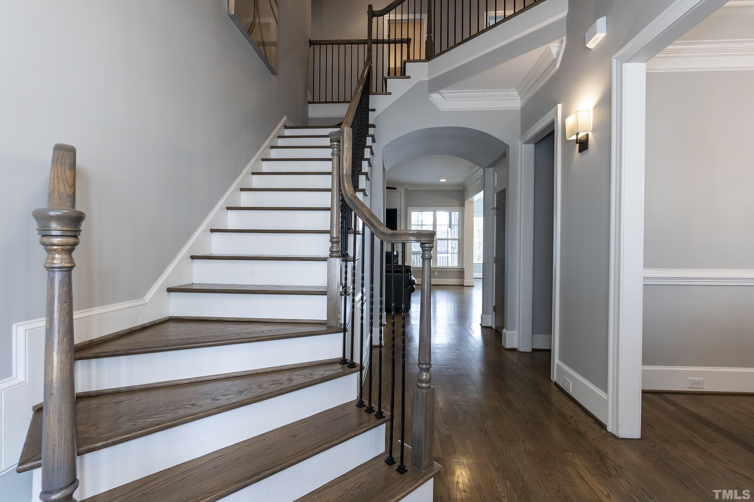6418 Rosny Road Raleigh, NC 27613 - Photo 6 of 52 a view of entryway and hall with wooden floor