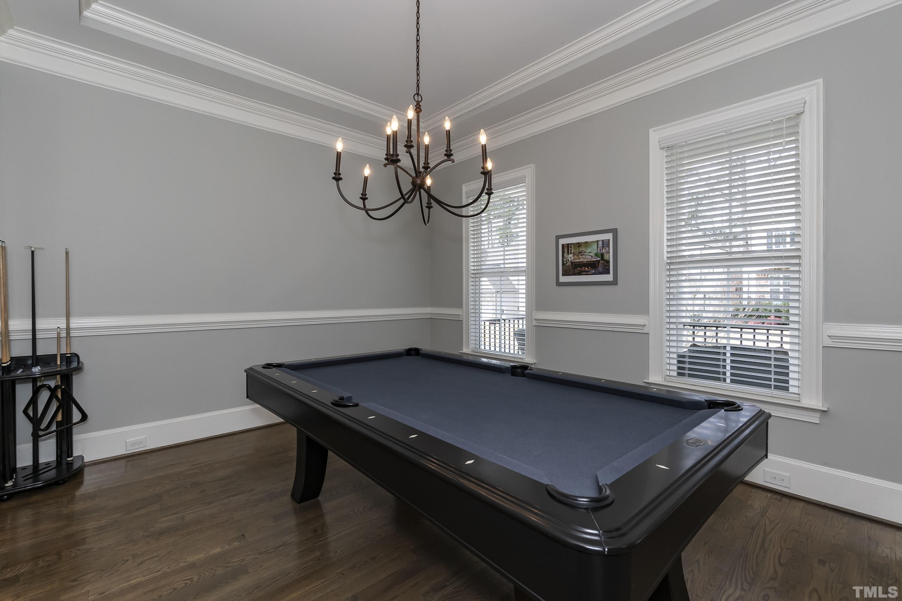6418 Rosny Road Raleigh, NC 27613 - Photo 8 of 52 a view of a room with a table chairs and wooden floor
