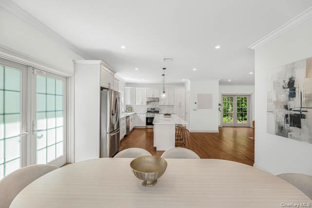 1 Kewanee Road New Rochelle, NY 10804 - Photo 8 of 36 a spacious bedroom with a large bed and a large window