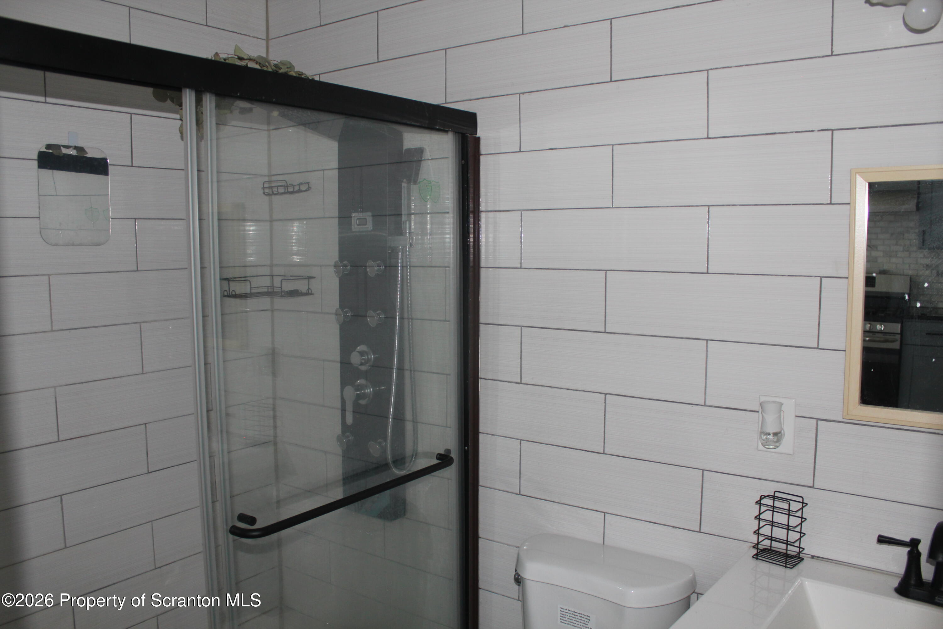1122 Luzerne Street, Unit A Scranton, PA 18504 - Photo 11 of 13 a bathroom with a shower