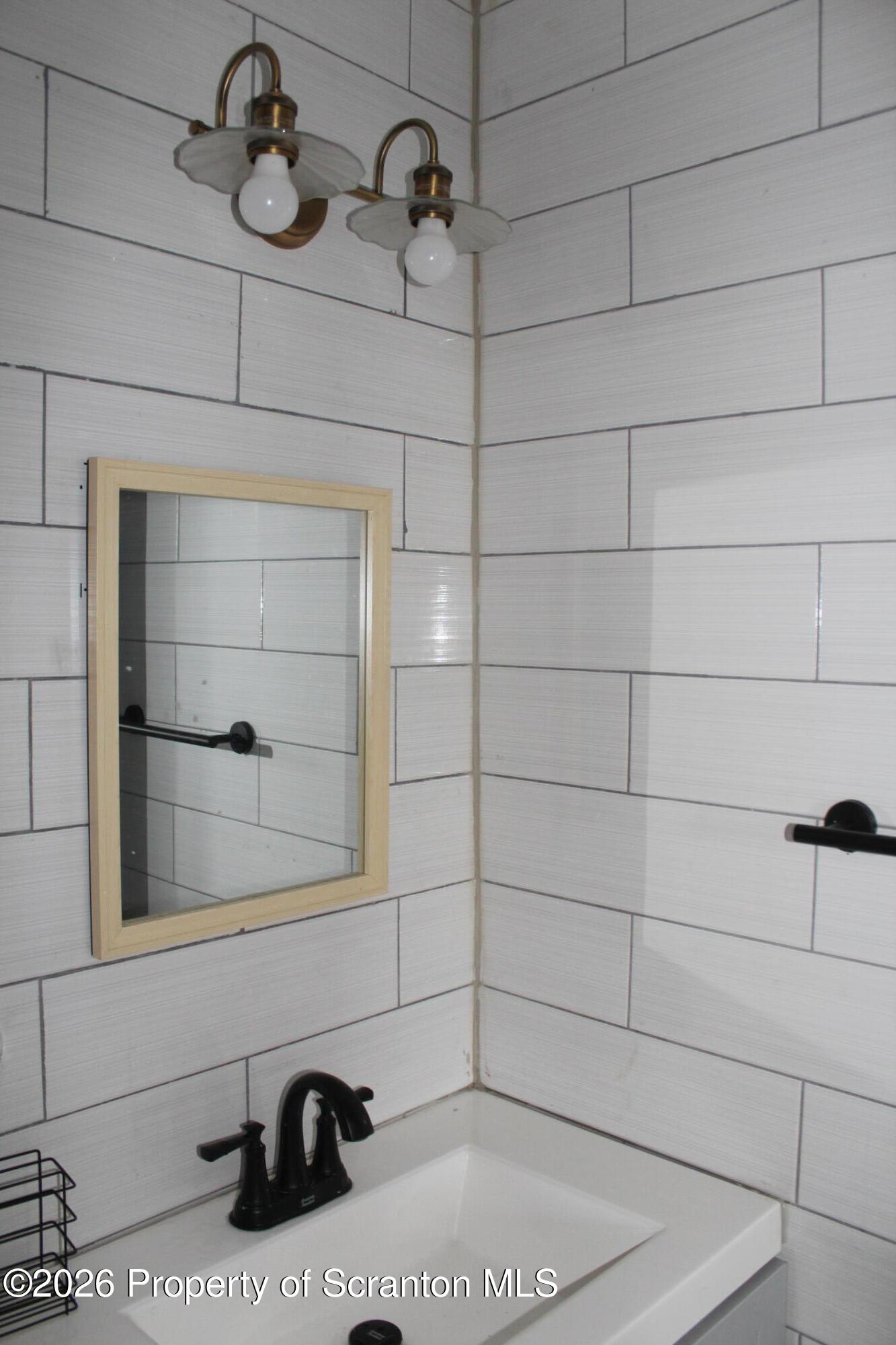 1122 Luzerne Street, Unit A Scranton, PA 18504 - Photo 12 of 13 a bathroom with a sink and a window