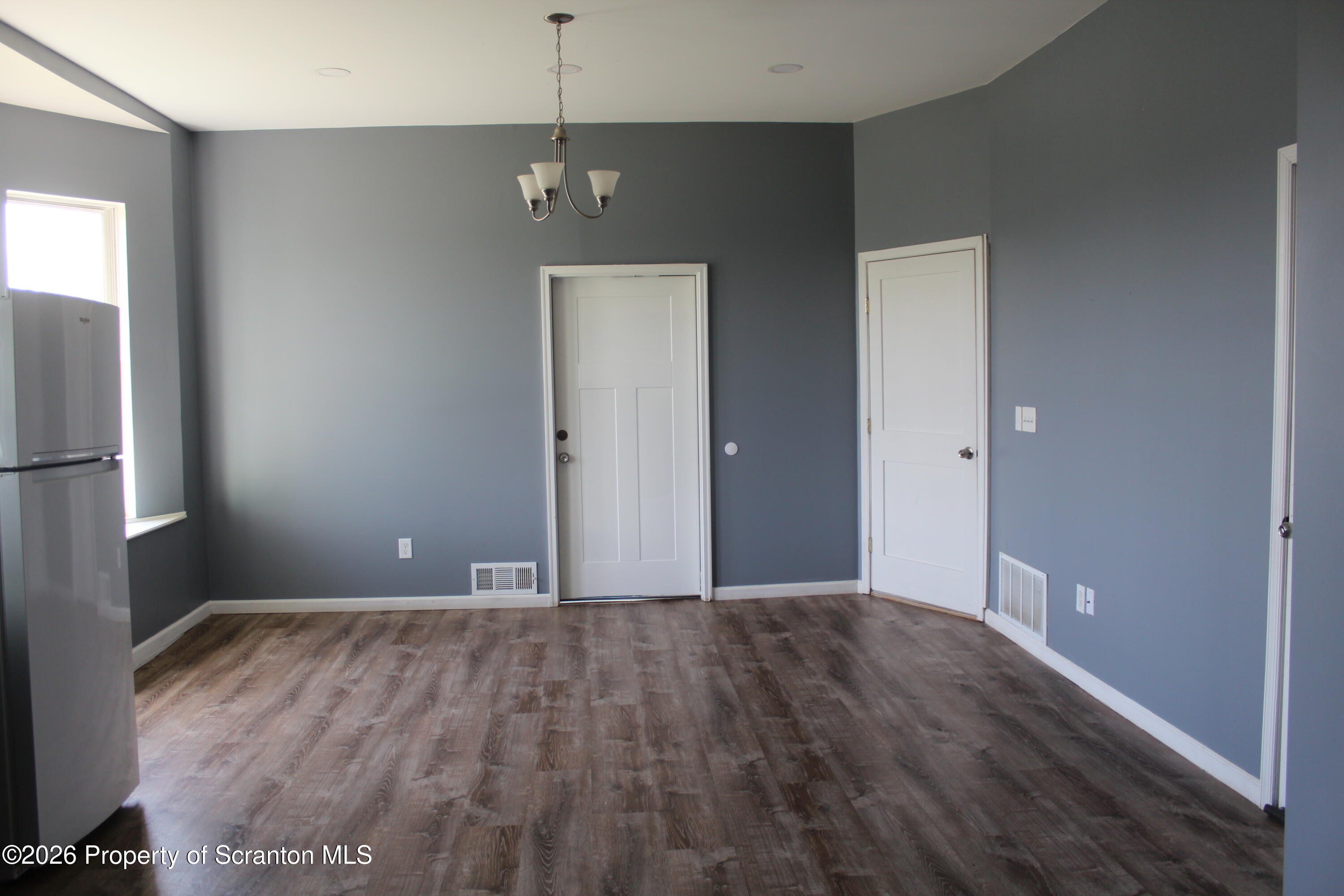 1122 Luzerne Street, Unit A Scranton, PA 18504 - Photo 5 of 13 a view of an empty room with a window