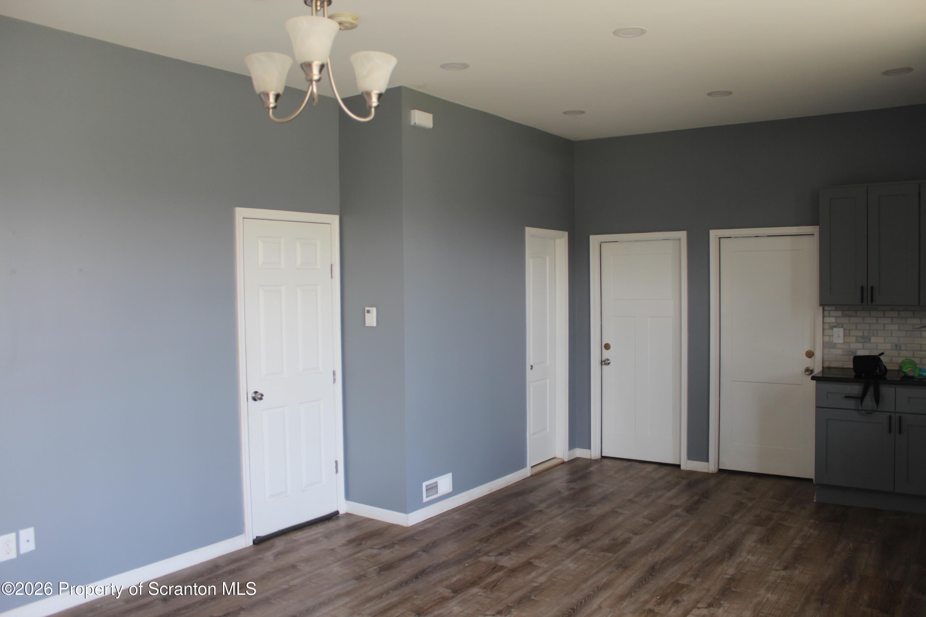 1122 Luzerne Street, Unit A Scranton, PA 18504 - Photo 6 of 13 a view of empty room with wooden floor