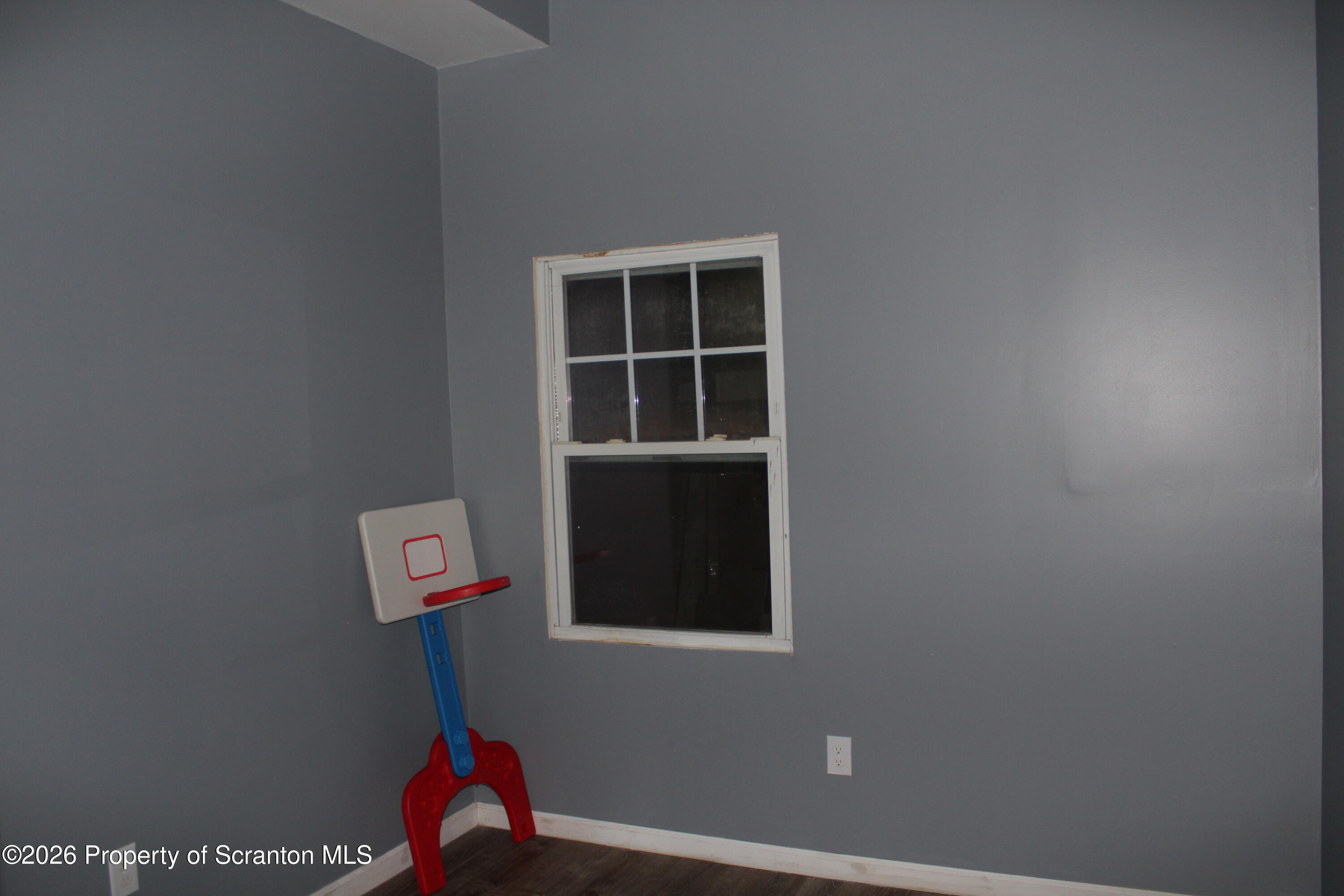 1122 Luzerne Street, Unit A Scranton, PA 18504 - Photo 10 of 13 a room with gym equipment and wooden floor