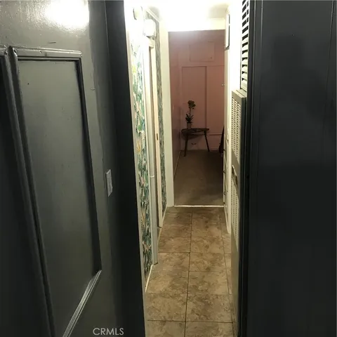 a view of a bathroom from a hallway