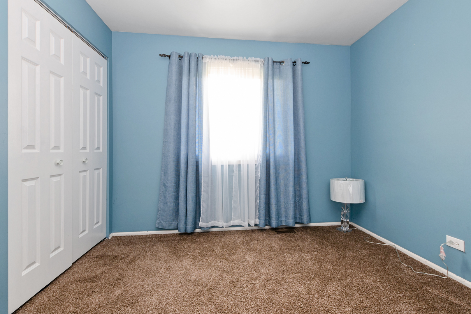 13 Oakview Road Matteson, IL 60443 - Photo 18 of 23 a view of an empty room with a window and closet area
