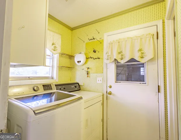 a bathroom with a sink mirror and a bathtub