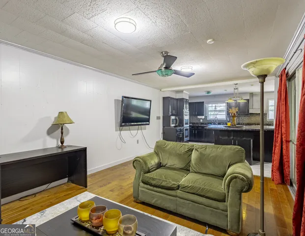 a living room with furniture and a flat screen tv