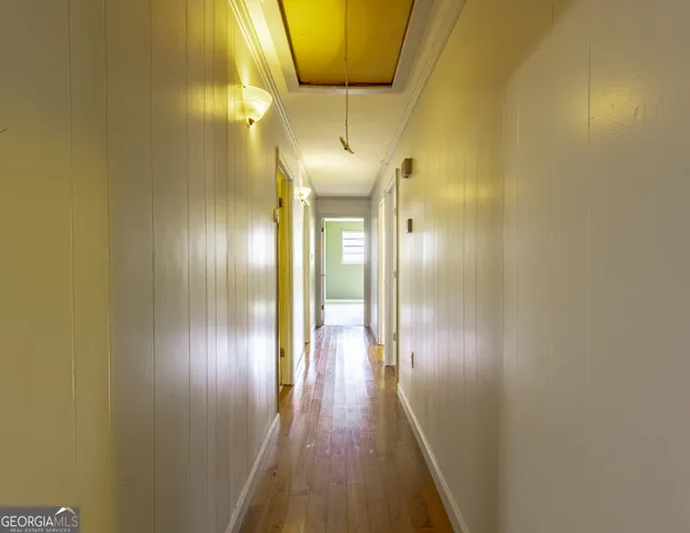 a view of gallery with wooden floor