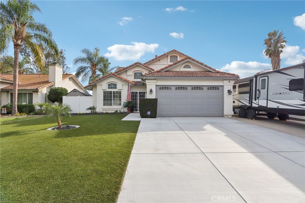 20307 Mesquite Canyon Road Riverside, CA 92508 - Photo 1 of 1 a front view of a house with a garden and yard