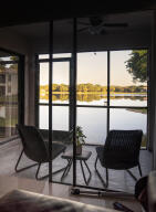 2650 Greenwood Terrace, Unit 1250 Boca Raton, FL 33431 - Photo 4 of 25 a view of a chairs and table in a room