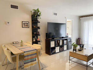 2650 Greenwood Terrace, Unit 1250 Boca Raton, FL 33431 - Photo 7 of 25 a living room with furniture and a flat screen tv