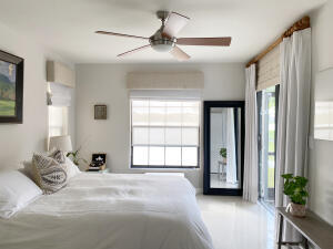 2650 Greenwood Terrace, Unit 1250 Boca Raton, FL 33431 - Photo 9 of 25 a bed room with a bed and a window