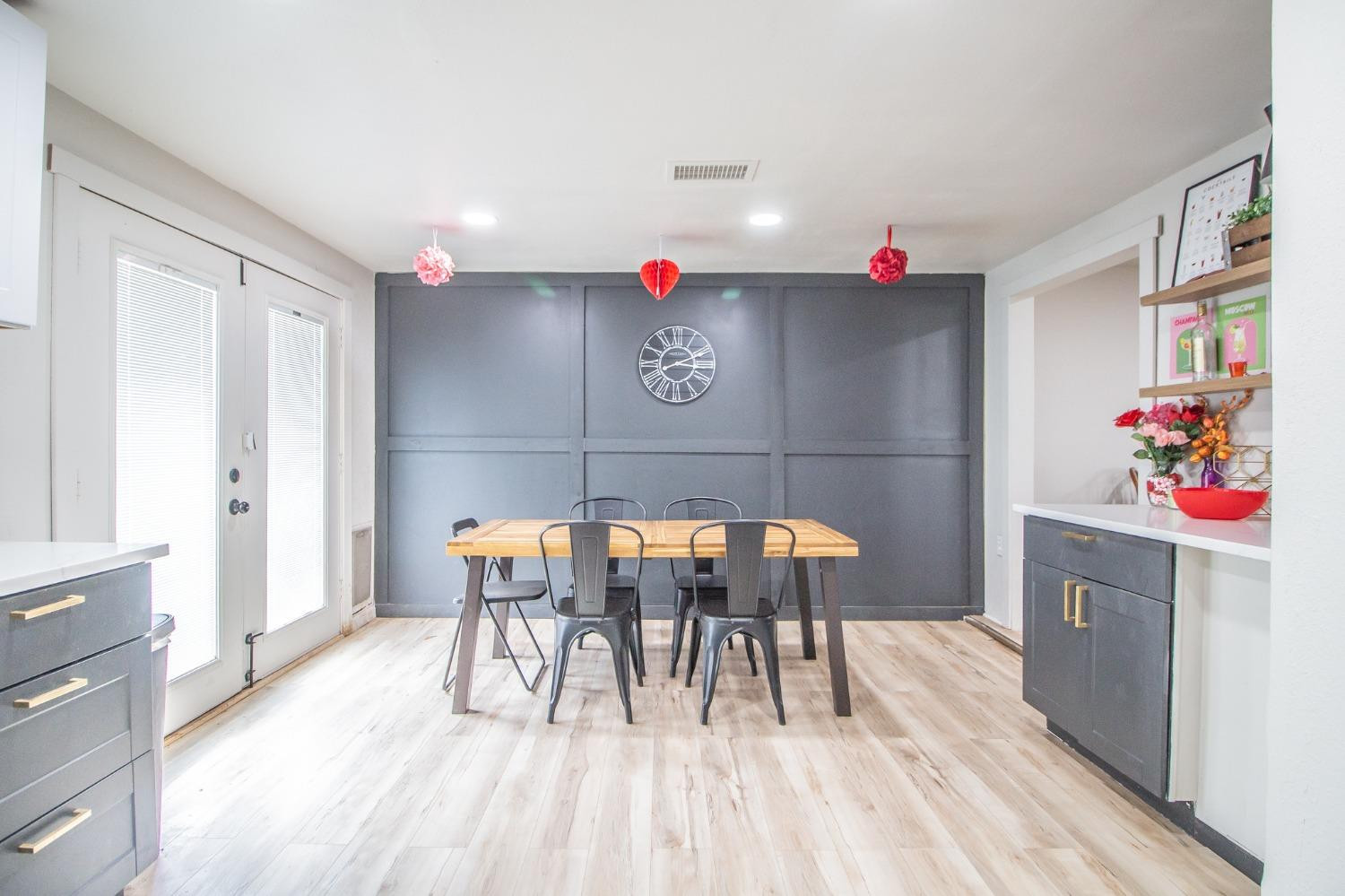 5411 32nd Street Lubbock, TX 79407 - Photo 11 of 22 a view of dining room with wooden floor and furniture