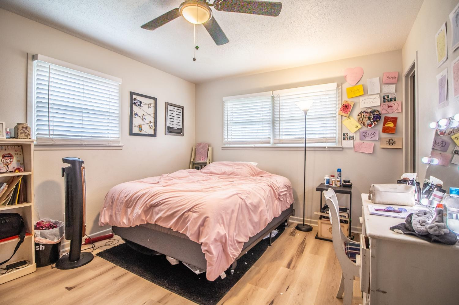 5411 32nd Street Lubbock, TX 79407 - Photo 13 of 22 a bedroom with a bed and wooden floor