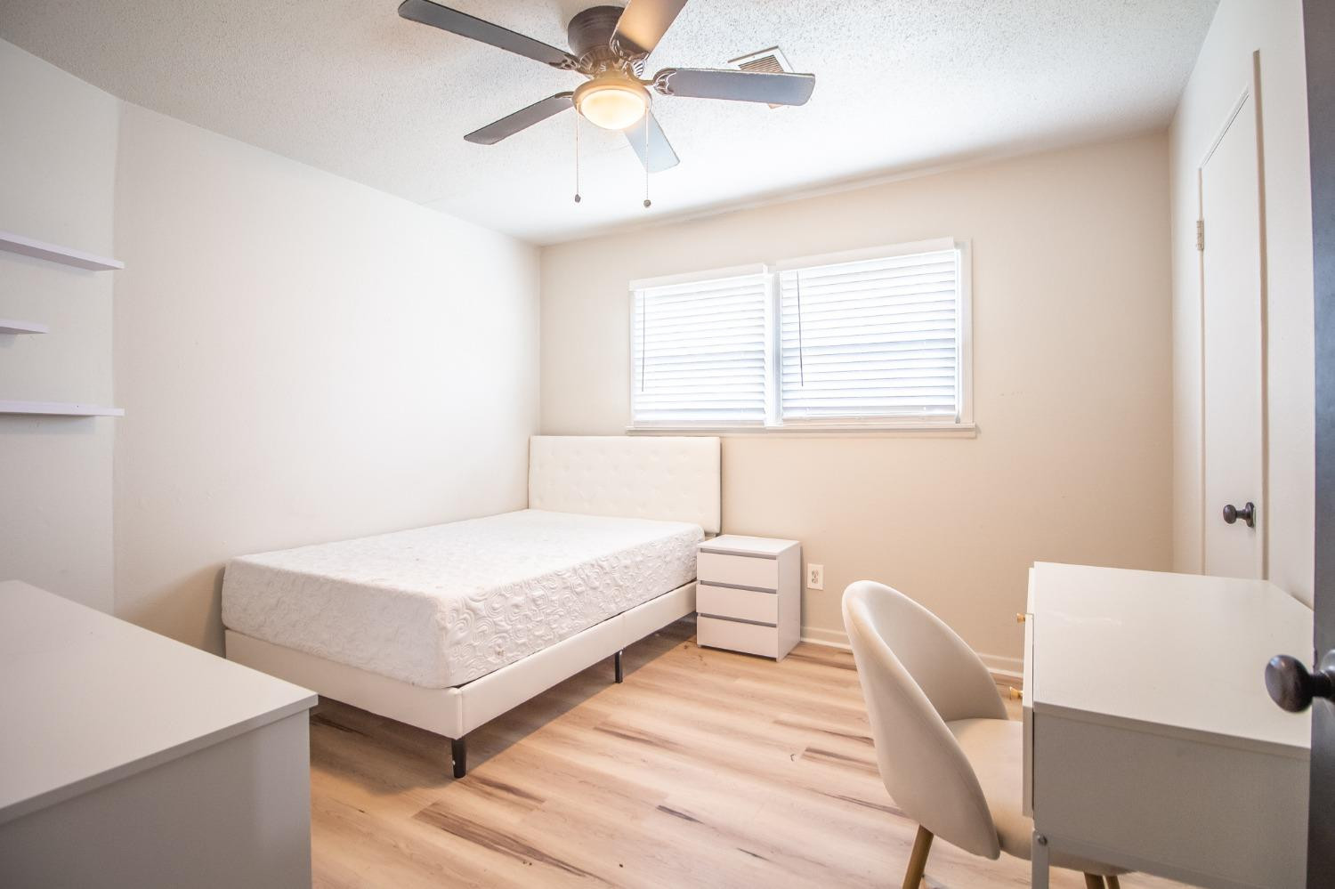 5411 32nd Street Lubbock, TX 79407 - Photo 16 of 22 a living room with furniture and a window