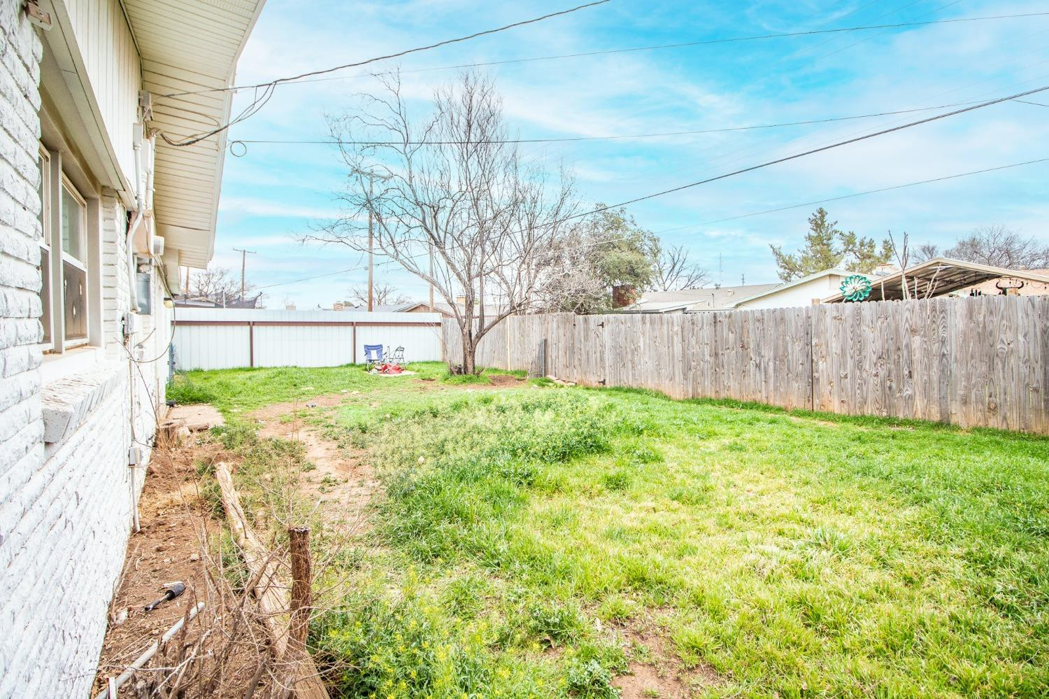 5411 32nd Street Lubbock, TX 79407 - Photo 20 of 22 a view of a backyard with a garden