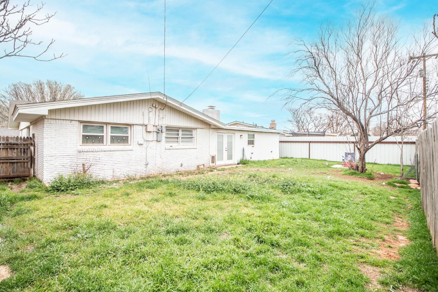 5411 32nd Street Lubbock, TX 79407 - Photo 22 of 22 a view of a house with a backyard