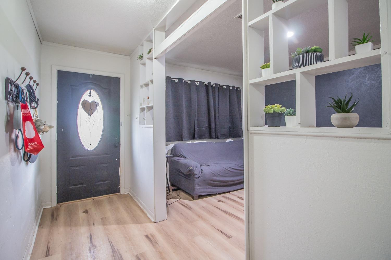 5411 32nd Street Lubbock, TX 79407 - Photo 3 of 22 a bedroom with a bed and a mirror