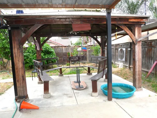 a view of a swimming pool with a patio