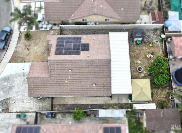 a front view of a house with parking area