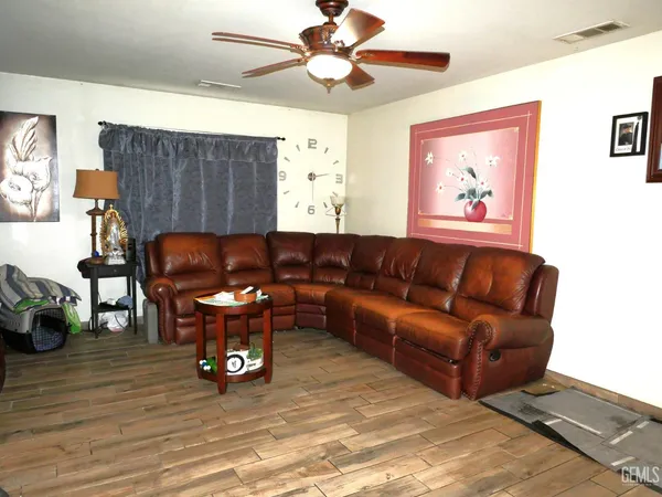 a view of a livingroom with furniture and a potted plant