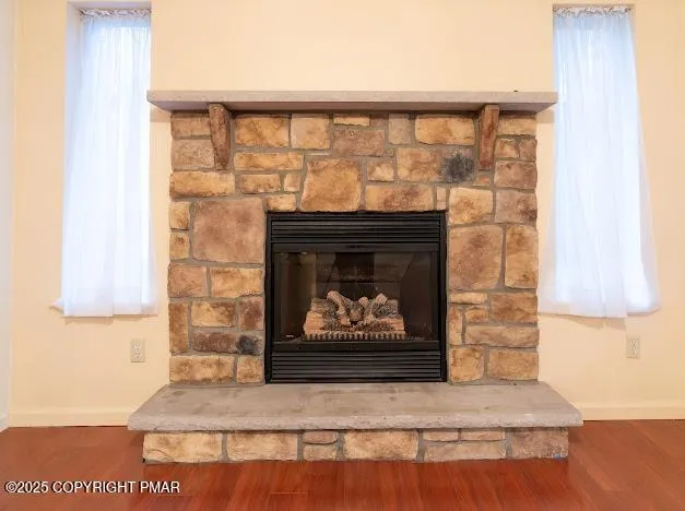 a fireplace with a wooden floor