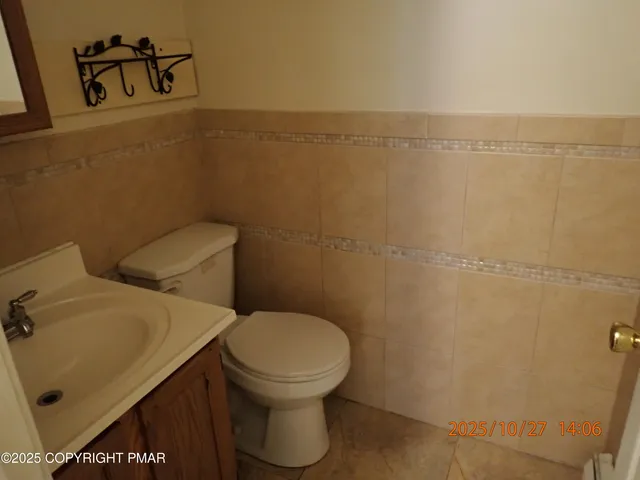 a bathroom with a toilet and a sink