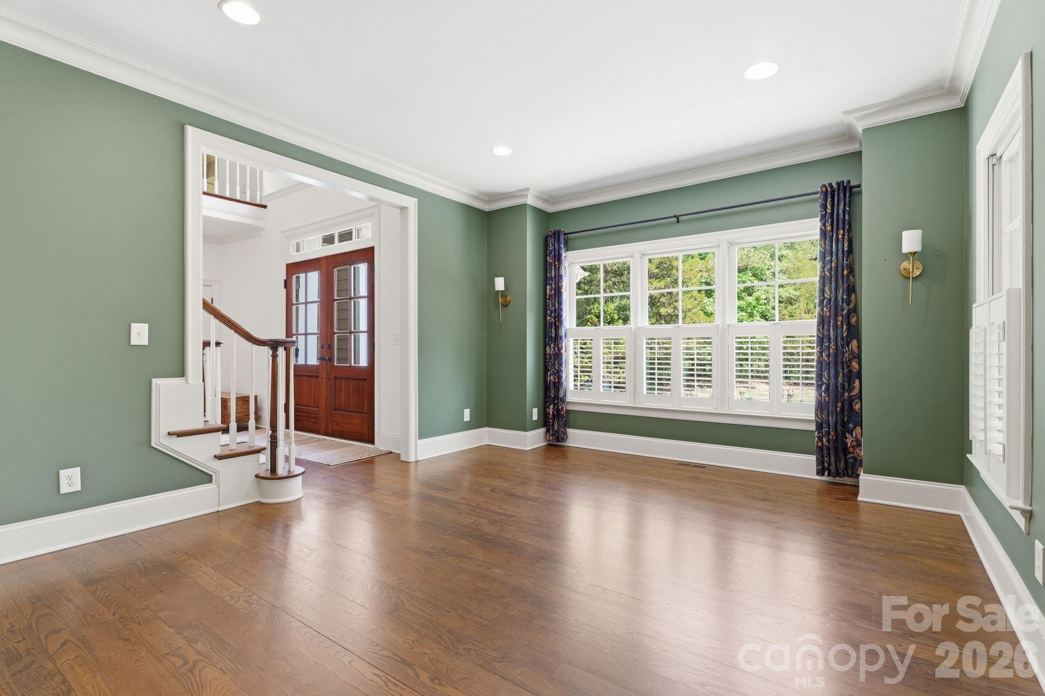 235 Grey Road Davidson, NC 28036 - Photo 3 of 42 a view of empty room with wooden floor and fan
