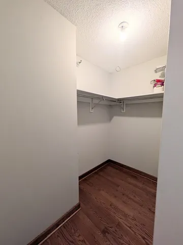 a living room with furniture and a open kitchen view