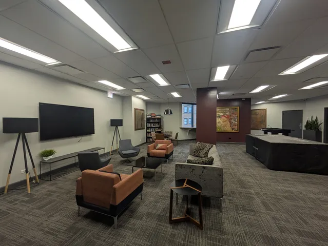 a kitchen with kitchen island a sink a stove and cabinets