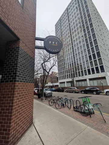 a pathway of a house with a yard