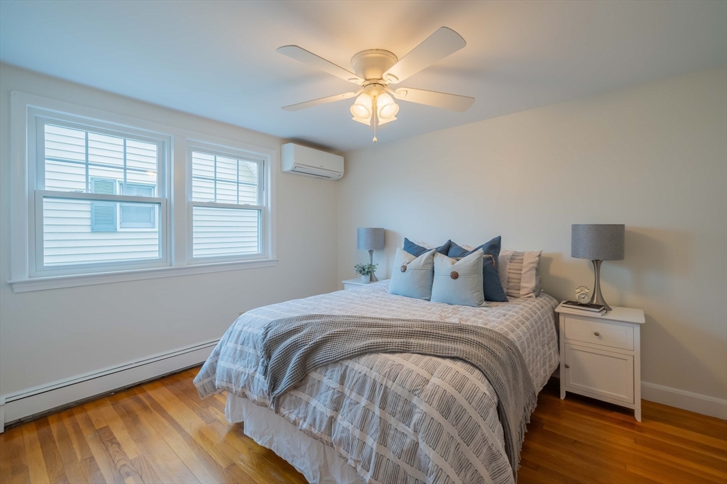 55 Sutherland Road, Unit 55 Arlington, MA 02476 - Photo 9 of 23 a bedroom with bed and a window