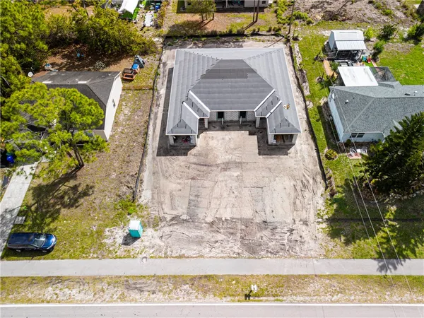an aerial view of a house with a ocean view