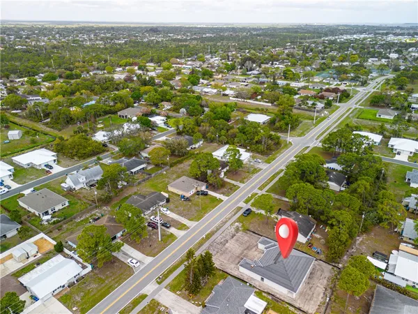an aerial view of residential houses with outdoor space