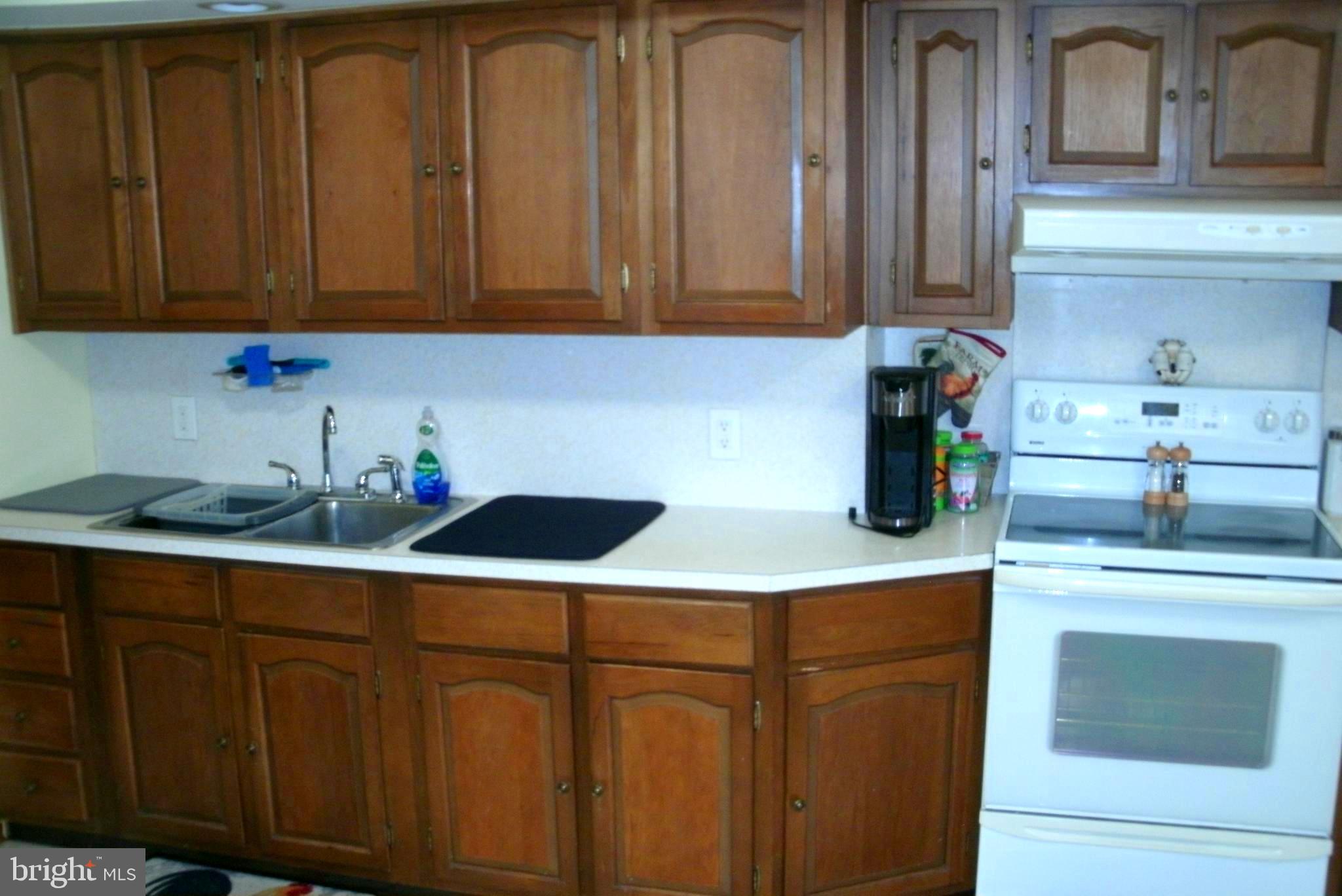 546 Compass Road East Middle River, MD 21220 - Photo 5 of 24 a kitchen with stainless steel appliances granite countertop white cabinets sink and dishwasher
