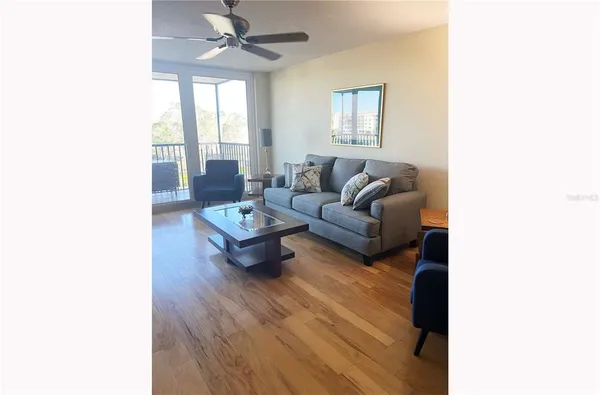 a living room with furniture and a large window