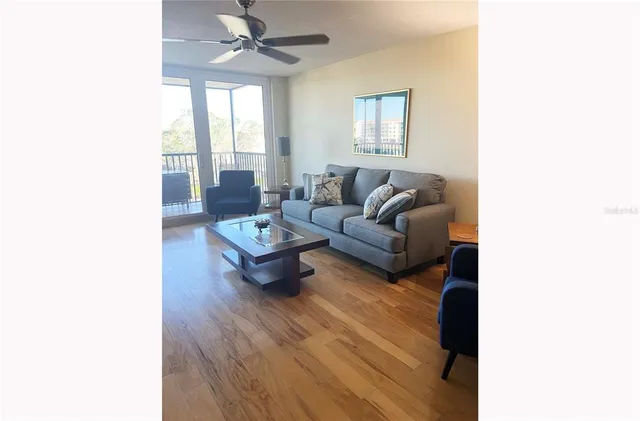 a living room with furniture and a large window