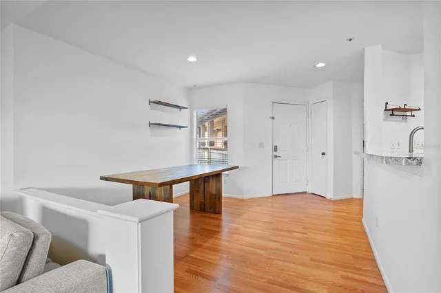 a view of a livingroom with furniture and wooden floor