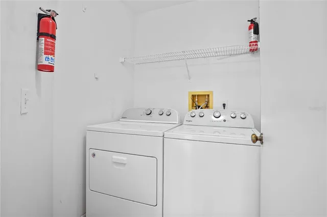a utility room with dryer and washer