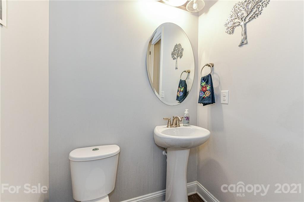 2756 Collaroy Road Waxhaw, NC 28173 - Photo 15 of 48 a bathroom with a toilet sink and mirror