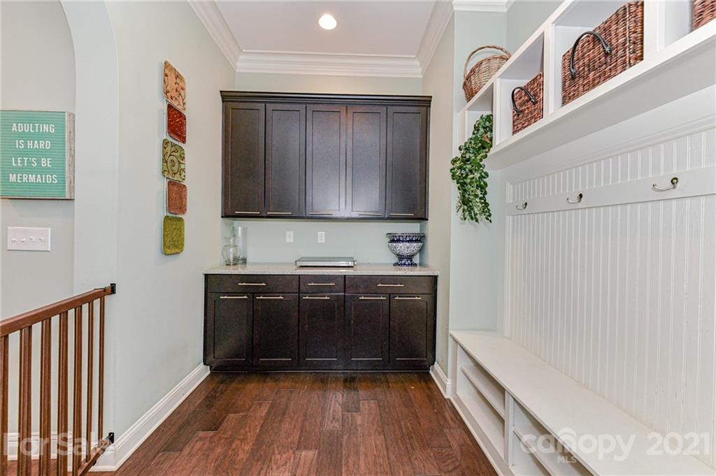 2756 Collaroy Road Waxhaw, NC 28173 - Photo 19 of 48 a kitchen with granite countertop wooden cabinets and a stove