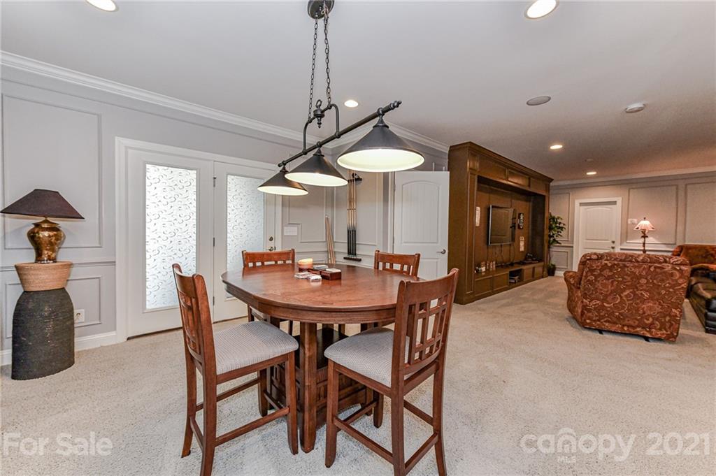 2756 Collaroy Road Waxhaw, NC 28173 - Photo 36 of 48 a view of a dining room with furniture and a chandelier