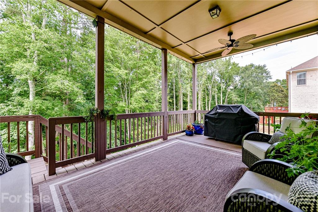2756 Collaroy Road Waxhaw, NC 28173 - Photo 42 of 48 a view of a porch with furniture and a yard