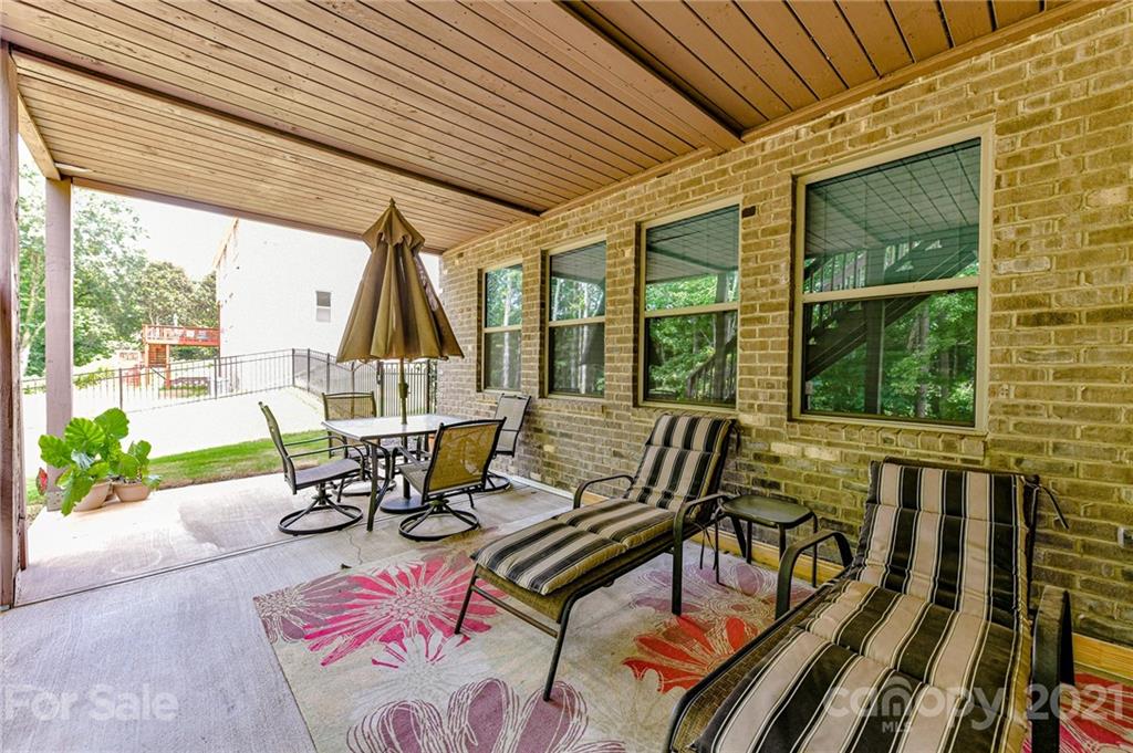 2756 Collaroy Road Waxhaw, NC 28173 - Photo 44 of 48 a view of a patio with a table and chairs