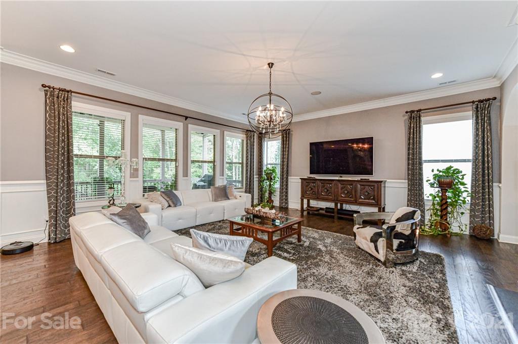 2756 Collaroy Road Waxhaw, NC 28173 - Photo 7 of 48 a living room with furniture a large window and a flat screen tv