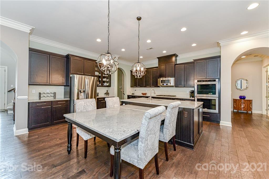 2756 Collaroy Road Waxhaw, NC 28173 - Photo 10 of 48 a view of kitchen with cabinets table and chairs