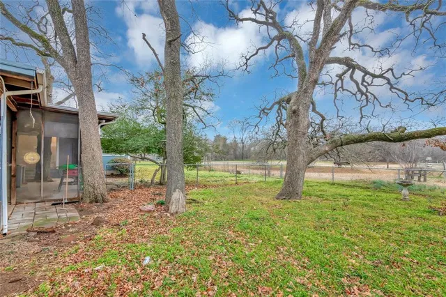 a view of a house with a garden and yard