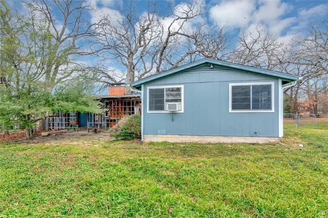 a view of outdoor space with garden and trees